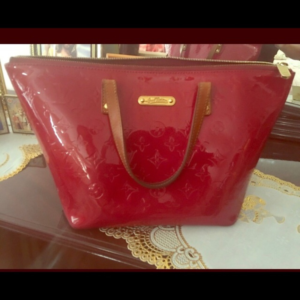 Red Louis Vuitton hand bag